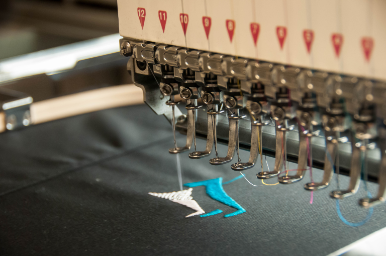 Embroidery machine creating an embroidered pattern